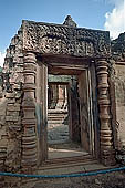 Banteay Srei temple - sculpted lintels and columns on the sides of the doors